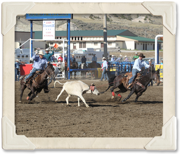 : A team rope their steer in the Team Roping event (©Watson Rodeo Photos, Inc.)